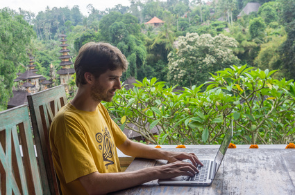Man working on laptop in Ubud, Bali, Indonesia
